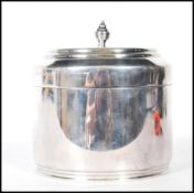 Christopher Dresser for Hukin & Heath silver plated biscuit barrel, hinged lid with finial top.