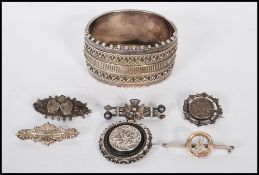 A collection of silver jewellery dating from the 19th Century onwards to include three silver