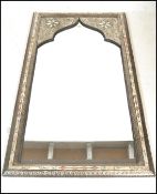 A contemporary North African white metal wall mirr