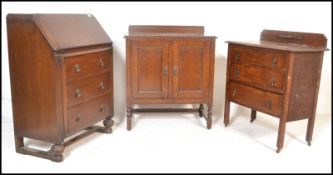 A collection of oak furniture dating the early 20th Century to include a bureau with fall front over