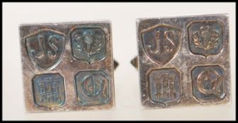 A pair of silver hallmarked cufflinks having a square head stamped with Edinburgh hallmarks for
