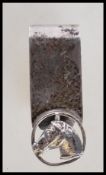 A silver hallmarked money clip having a pierced decoration horse portrait. Bears import hallmarks to