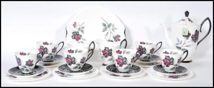 A Royal Albert coffee service in the Masquerade pattern comprising of cups, saucers, side plates,