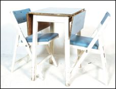 A vintage mid 20th Century two tone drop leaf dining table, blue formica top raised on a painted