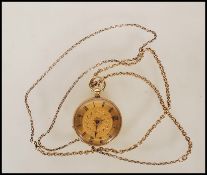 A vintage 18ct gold open faced pocket watch having a gilt face with roman numerals to the chapter