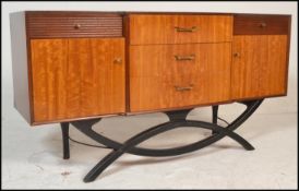 A mid 20th Century teak wood sideboard / credenza, central bank of three drawers flanked by