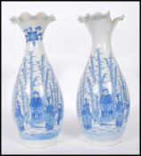 A pair of Japanese porcelain blue and white vases having flared and fanned rims with transfer