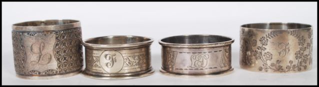 A group of four silver hallmarked napkin rings, two being hallmarked for Chester one date letter