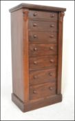 A 19th century Victorian Wellington pedestal chest of drawers being raised on plinth base with a