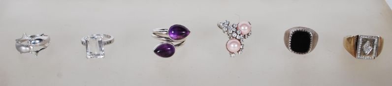 A group of six silver rings to include a stamped 925 dress ring set with pink pearls and white