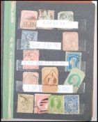 A small stamp album containing stamps from all around the world dating from the 19th Century to