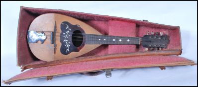 An early 20th Century Gennaro Maglioni mandolin instrument having tortoise shell to the scratch