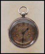 A Gent`s antique silver pocket watch by `L.B. Tuchman`, Birmingham, key wind, ornate silver coloured