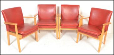 A set of four vintage retro Parker Knoll model 733 open framed armchairs, sweeping arms, seat pads