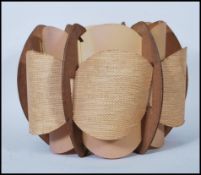 A 20th century retro vintage layered lamp light fixture shade having a hessian type fabric back with