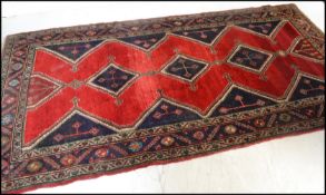 A stunning believed early 20th Persian / Islamic rug believed to have been bought at Liberty of