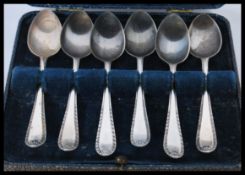A cased set of 20th century silver hallmarked teaspoons complete in the original presentation case