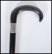 A early 20th Century 1920's silver collared promenade walking stick cane having horn crook handle