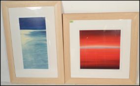 Two framed and glazed limited prints of seascapes, one being blue in colour as the tide  comes in