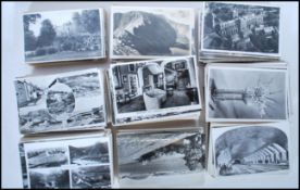 A large collection of vintage real photographic postcards. All B&W standard (small) size British