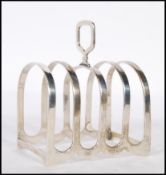 A silver hallmarked four slice toast rack, Birmingham assay mark with makers mark for S.L possibly