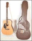 A 20th Century left handed six string acoustic gui