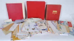 A collection of first day covers and stamped envelopes dating from the 19th Century, album of