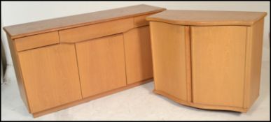 A Skovby 20th century light oak sideboard having a wide body with a series of blind fronted