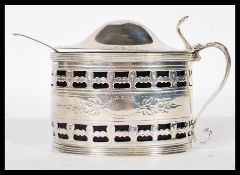 A George III large silver hallmarked and blue glass lined condiment lidded dish with handle by