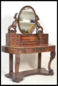 A Victorian mahogany duchess dressing table raised on turned supports with serpentine shaped