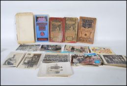 A collection of vintage postcards to include topographical scenes, military, school scenes,