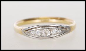 A stamped 18ct gold ring set with a row of round cut graduating diamonds to the head. Weight 2.5g.