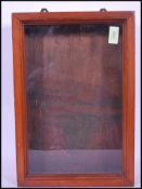 A 20th Century wooden shop table top display jewellery and collectables cabinet having a glass