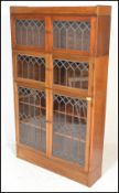A 20th Century mahogany three sectional lawyers bookcase in the manner of Globe Wernicke. The