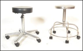 Two retro 20th Century industrial medical / dentists stools, both stools fitted with circular seat