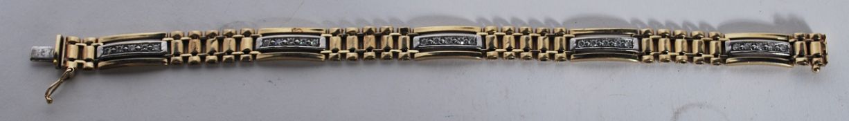 A vintage 9ct gold Italian gold ladder link bracelet having white gold spacers set with round cut