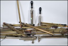 A large collection of vintage early to mid 20th Century brass / copper hand held garden sprayers