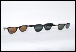 A group of three designer sunglasses by Ray Ban to