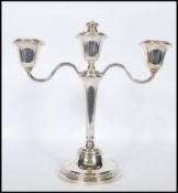 A silver hallmarked Mappin & Webb candelabra being raised on a round stepped base having a