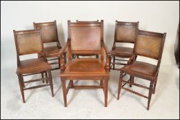 A set of six Harlequin late 19th Century Victorian panel dining chairs, panel seat pads with leather