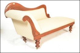 A  late Victorian 19th century mahogany framed chaise longue with exposed moulded show frame,