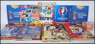 A collection of Panini Football sticker albums dating from the 1980's, several albums unopened in