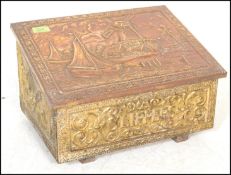 An 20th Century slippers box of wooden construction with copper panelling to the exterior having