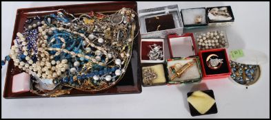 A collection of vintage costume jewellery to include necklaces, bangles, earrings, beaded necklaces,
