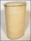 A vintage mid 20th Century industrial metal flour bin, hinged lid to the oval flour bin body.