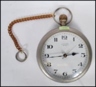 A Landex novelty wall clock in the form of an oversized pocket watch havinga white enamelled face