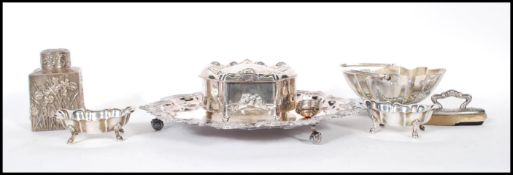 A good collection of silver plated items to include two large hinged trinket pots in the rococo