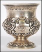 A 19th Century Victorian silver hallmarked goblet having embossed and engraved floral decoration,