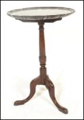A 19th century mahogany wine table of good proportions. The tripod base with scrolled legs and
