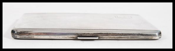 A silver hallmarked machine turned cigarette case,